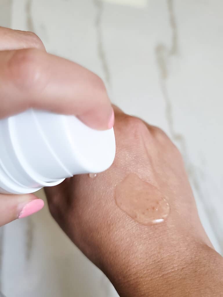 close up of a serum made using polyquats on hand