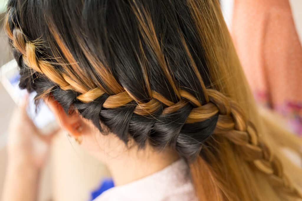 orange hair in a braid with brown hair