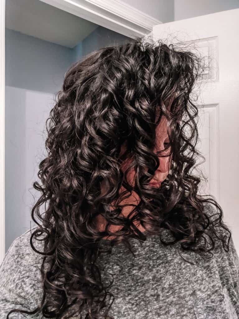Side view of flaxseed gel results on Delilah's curly hair