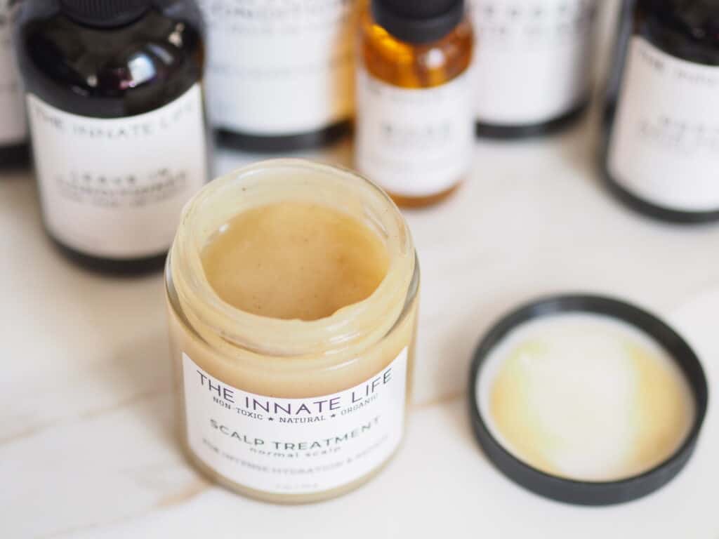 The Innate Life Scalp Treatment open jar on counter