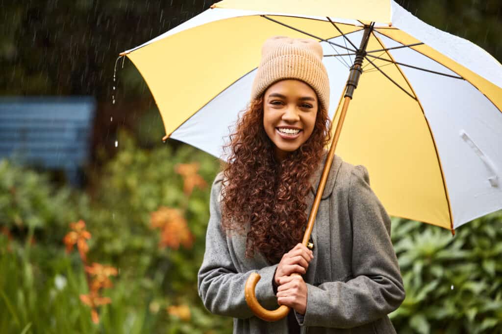 woman with curly hair in the rain